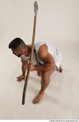 ATILLA KNEELING POSE WITH SPEAR